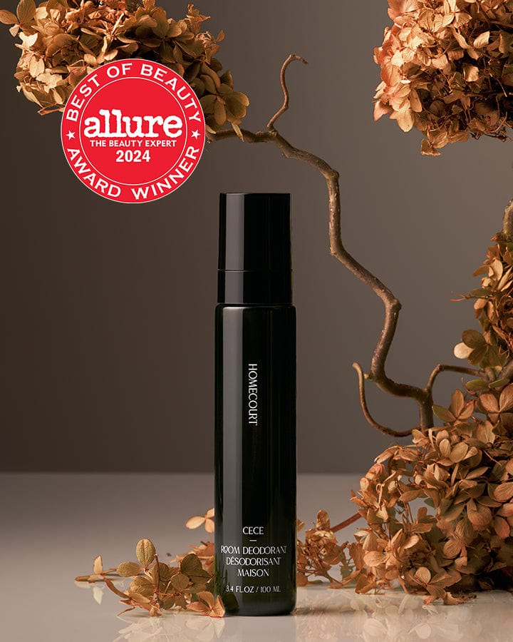 Best of Beauty Allure Award Winner Homecourt Room Deodorizer Cece Fragrance next to dried cece flower branches.
