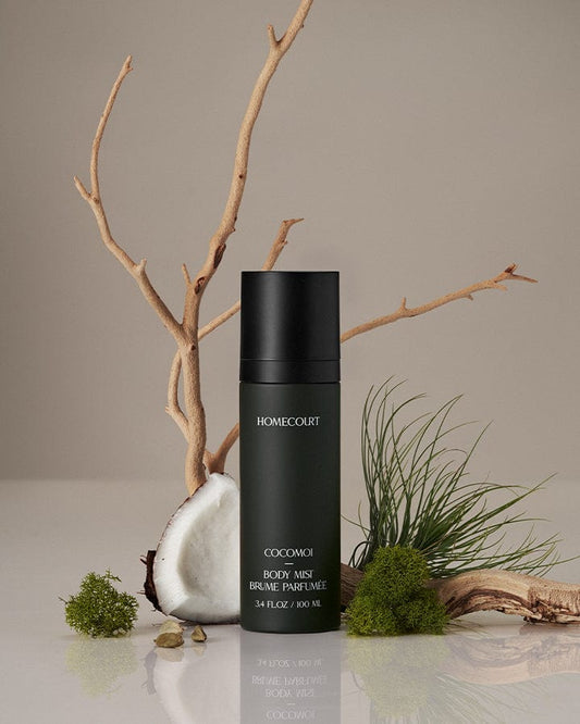 Homecourt Award-Winning body mist bottle labeled 'Homecourt' on a neutral background with natural elements.