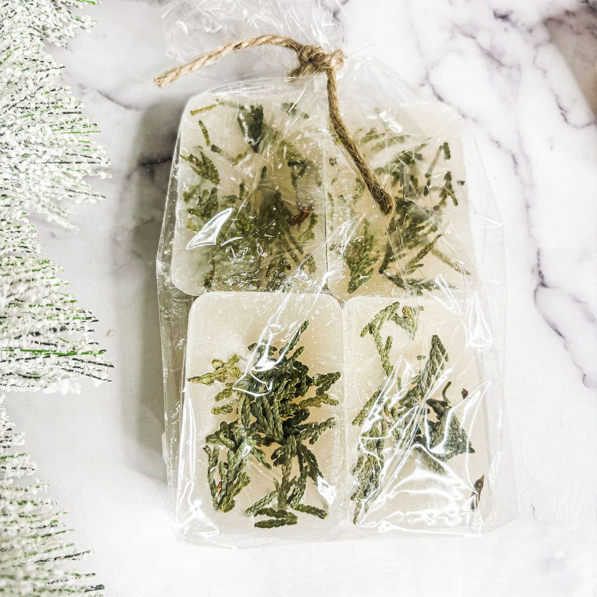 Christmas Tree XL Wax melt bag in clear packaging on a marble surface