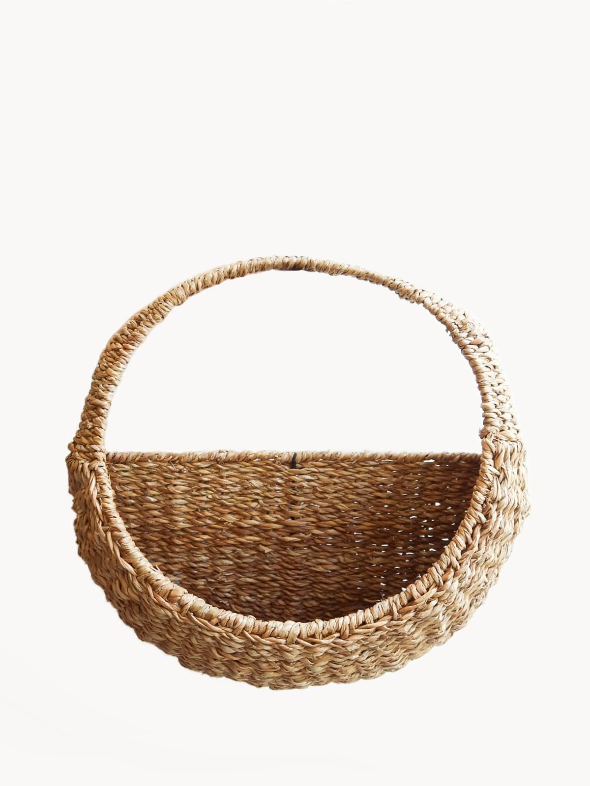 Savar Handwoven Seagrass Wall Hanging Basket with white background.