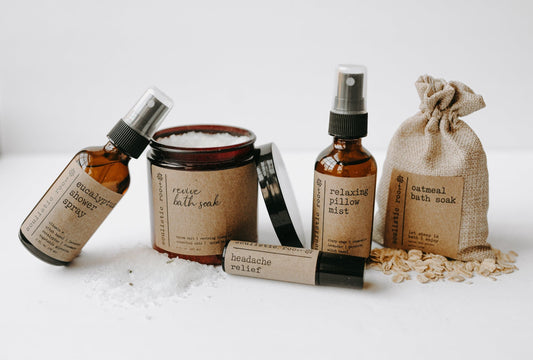 5-Piece Therapeutic Spa Gift Set of natural products with labels on a white surface.