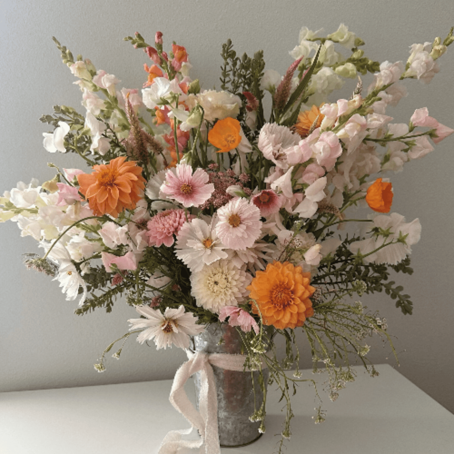 Dahlias, cosmos, snapdragons, poppies and more, grown with organic farming techniques & arranged by Little Mountain Flowers