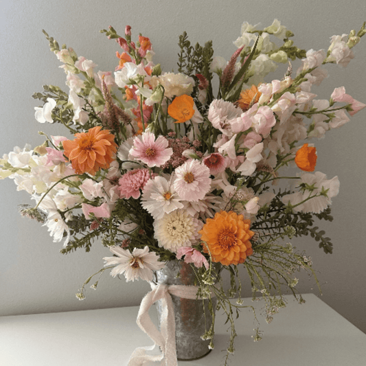 Dahlias, cosmos, snapdragons, poppies and more, grown with organic farming techniques & arranged by Little Mountain Flowers