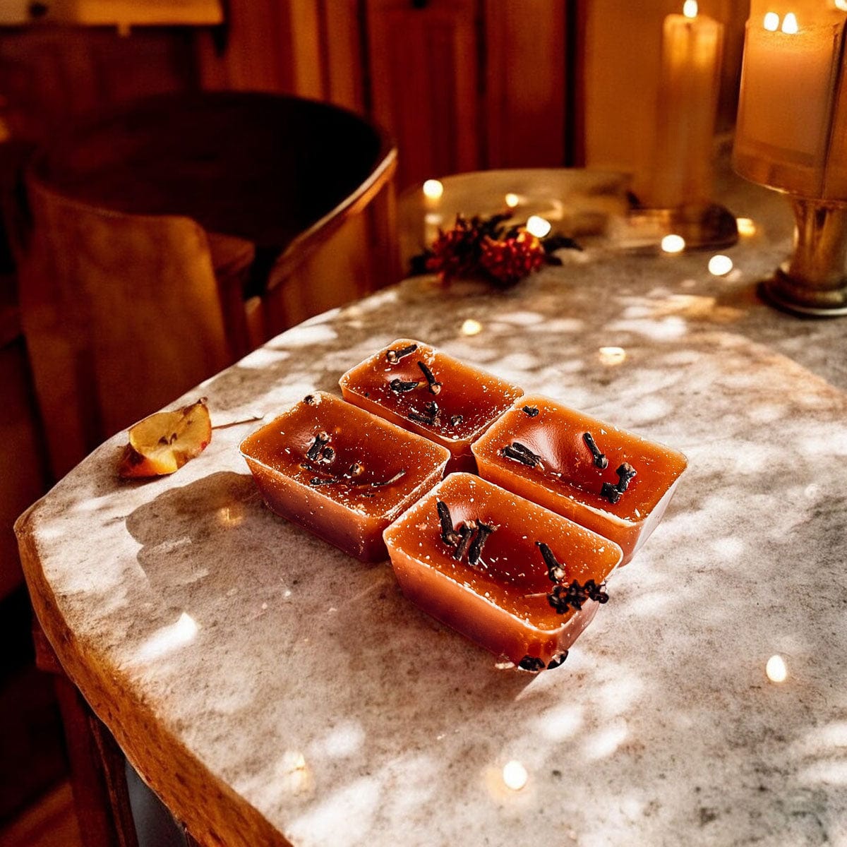 Four Spicy and Sweet Fall Clove XL wax melts on a marble surface, surrounded by candles and decorative fall items.